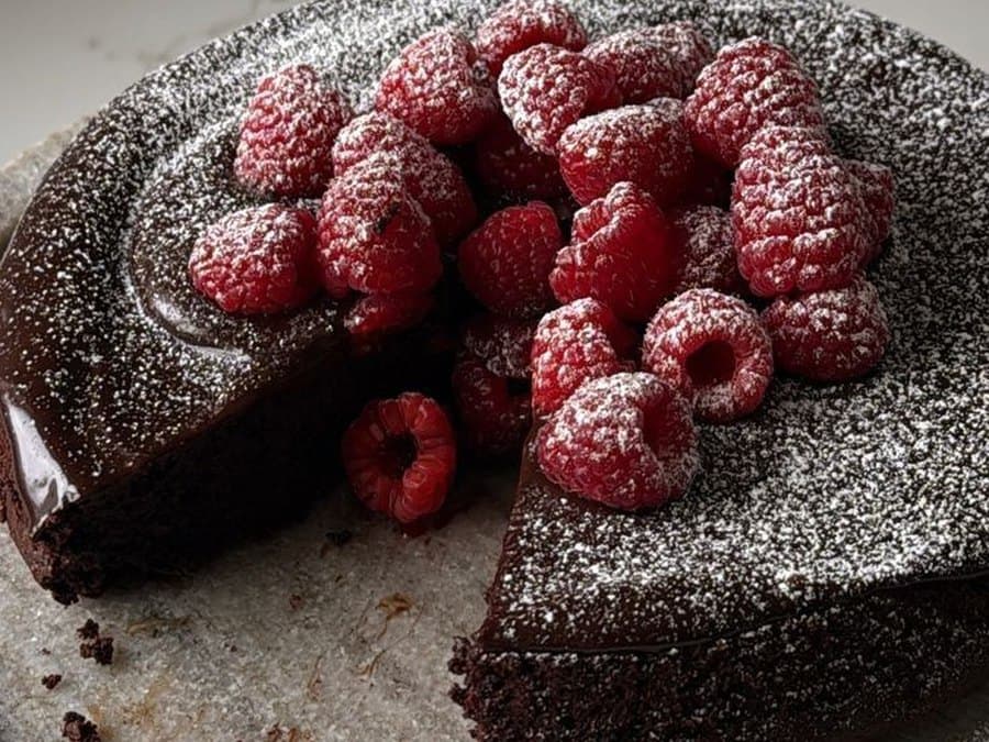 Chocolate cake piled with raspberries