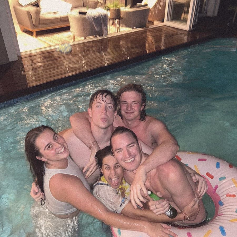 Friends piled into a pool