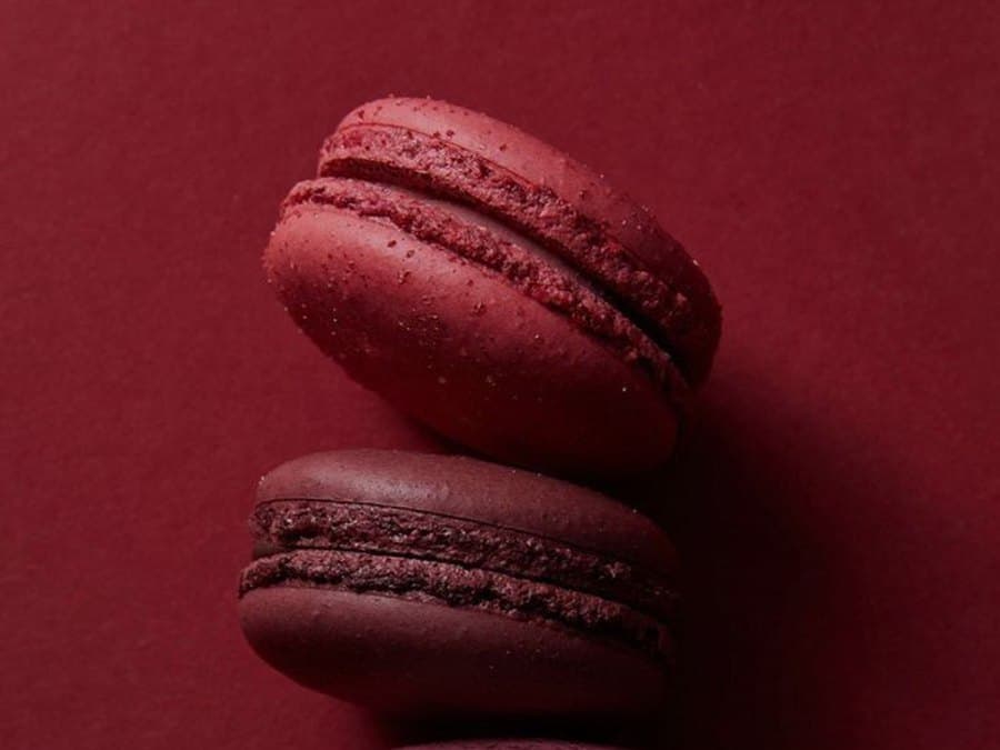 Macarons stacked on red